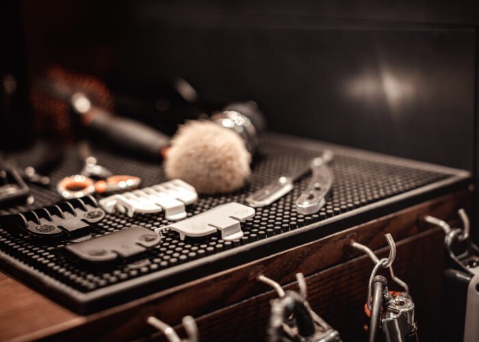 Shaving accessories and tools of barber shop on wooden background